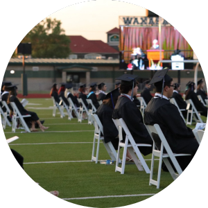 teens seated at graduation